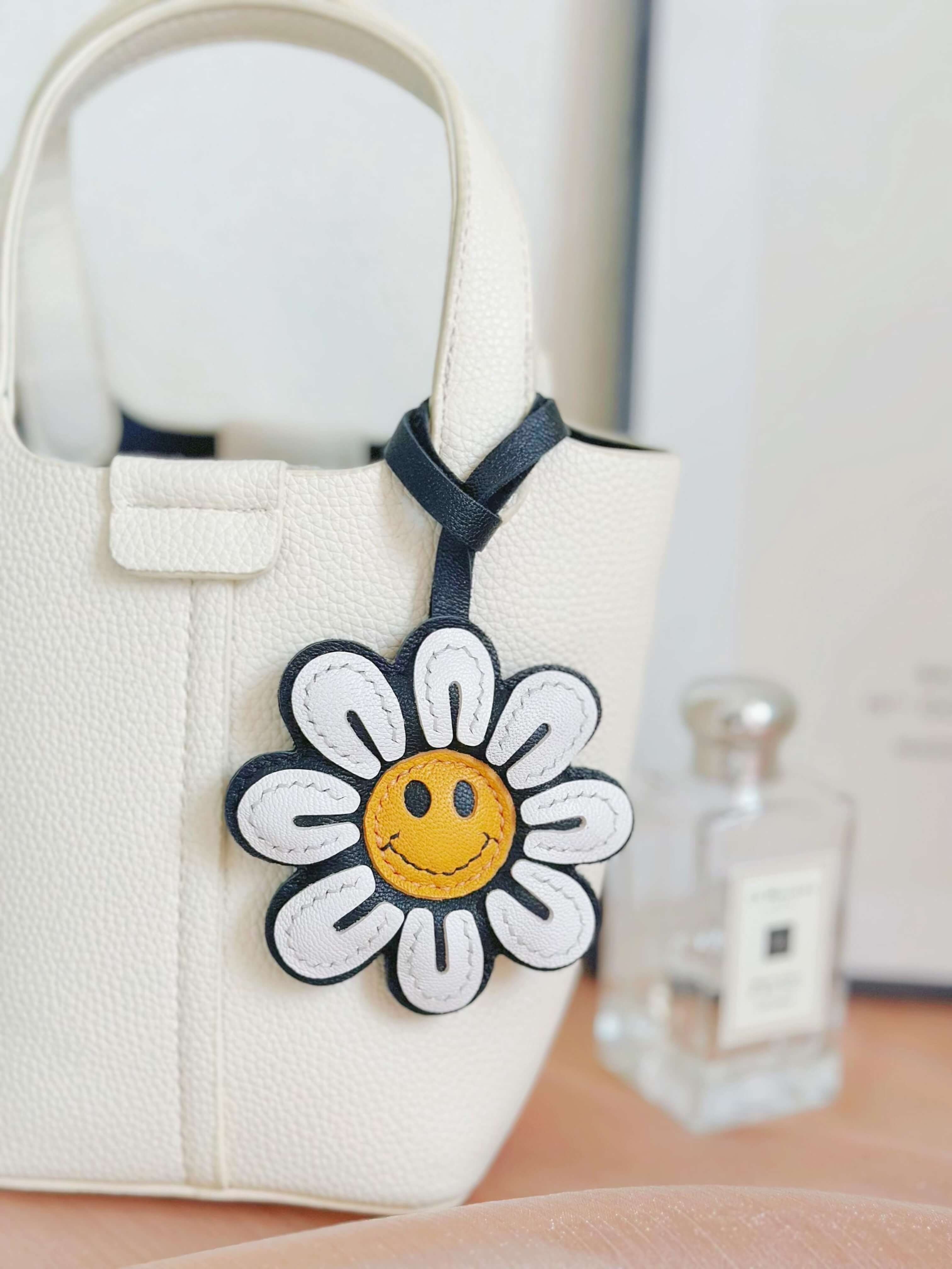 Glad blomma-väskberlock
